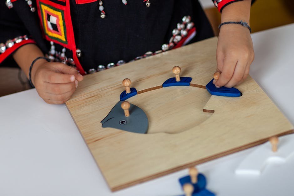 Child in traditional outfit assembling wooden fish puzzle indoors.